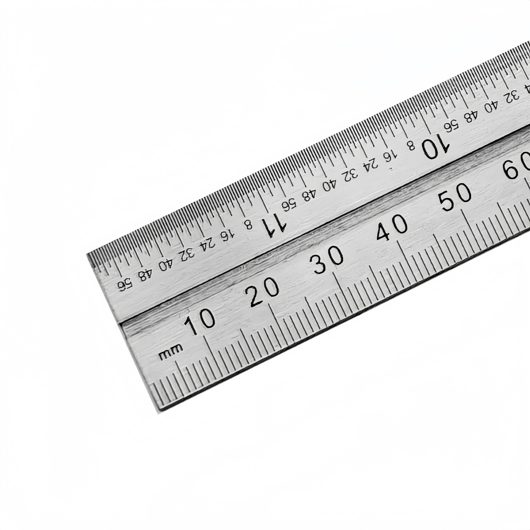 A stainless steel ruler with both inch and millimeter scales, shown diagonally on a plain white background.