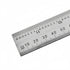 A stainless steel ruler with black printed measurements in centimeters and millimeters, shown diagonally on a plain white background.