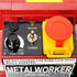 Close-up of a red and black industrial control panel with a yellow and red emergency stop switch, black rotary knobs, and a white label reading 'METAL WORKER VARIABLE'.