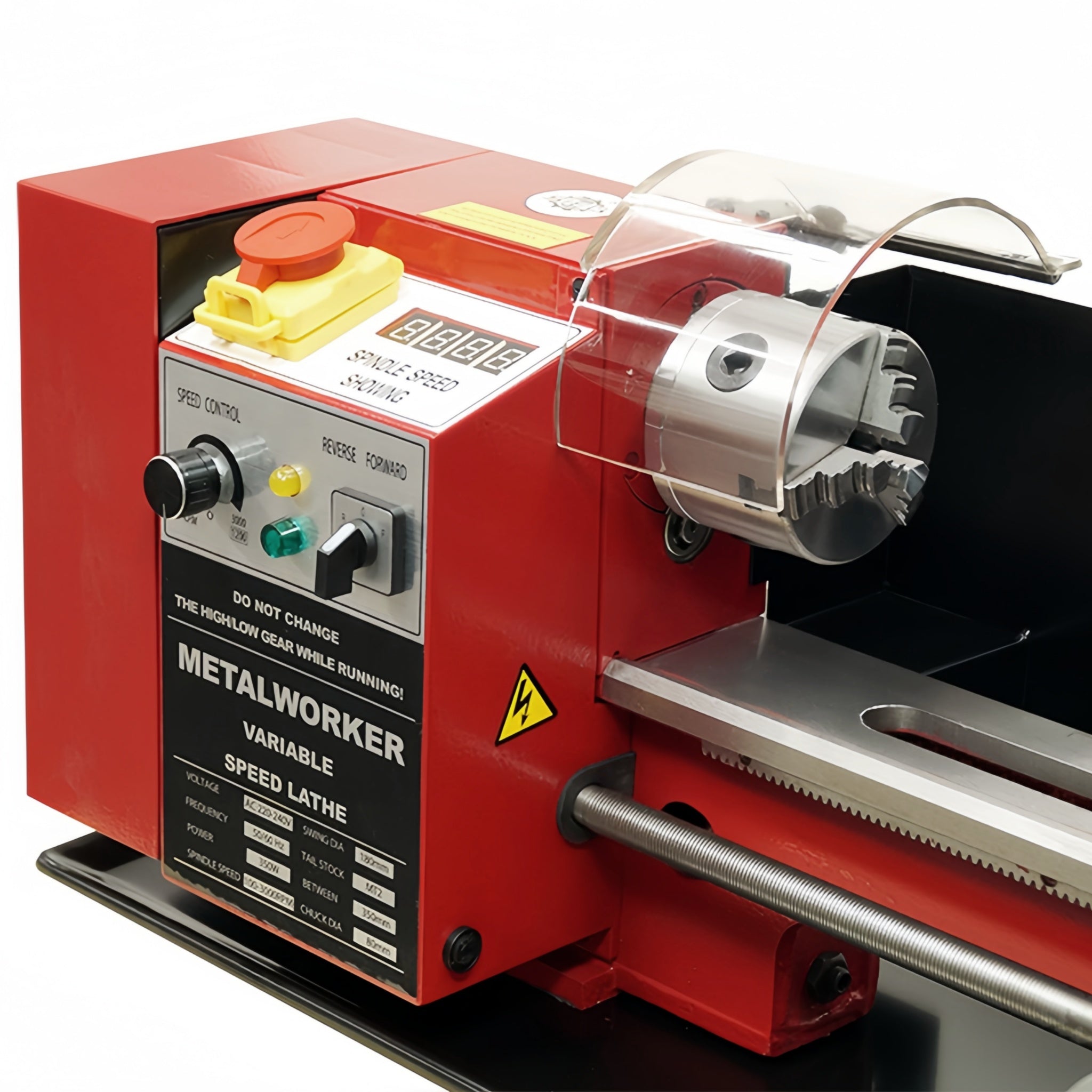 A red metal lathe machine with a clear protective guard, silver metal worktable, and black control panel labeled 'METALWORKER'.