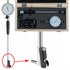 A precision dial indicator set shown open in a wooden case, with the indicator rod and feet displayed outside the case. A red circle and arrow highlight the feet.