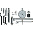 A metal dial indicator set with a silver dial gauge, multiple silver and black metal extension bars, mounting pieces, washers, and wrenches, arranged on a plain white background.