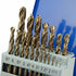 A set of metallic drill bits in various sizes displayed in a white plastic holder with size markings, photographed against a blue and white background.