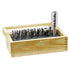 Set of metal counterbore in a wooden holder on a white background