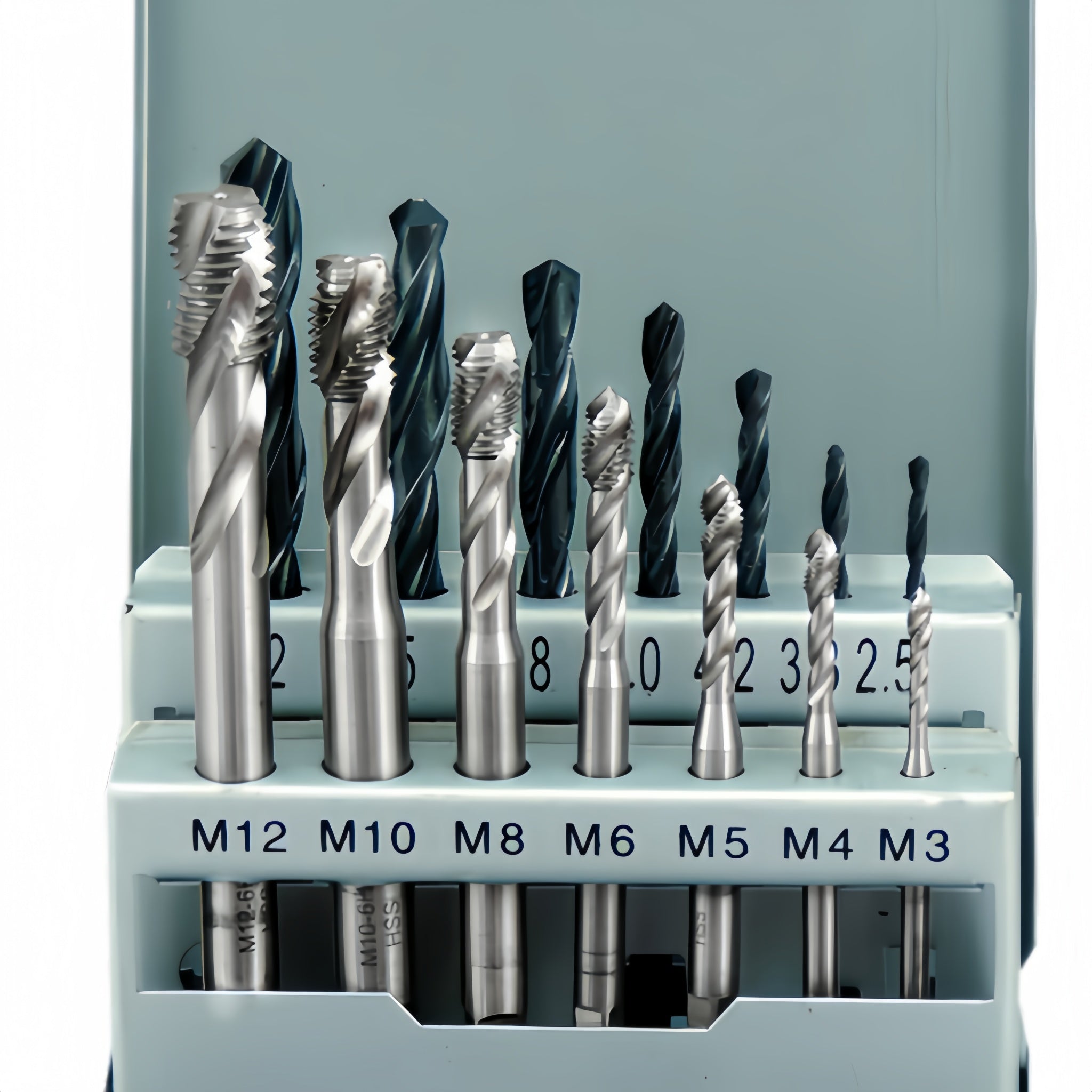 Set of drill bits in a holder with size markings on a gray background