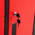 Close-up of a bright red metal locker or cabinet door with a black vertical trim strip, a silver lock cylinder, two black keys inserted, and a black rectangular handle plate.