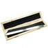 A stainless steel straight edge tool with a bevelled edge, placed inside an open wooden case with a black foam lining.