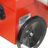 Close-up of a red industrial machine component with a black circular wheel, a black cylindrical tube, and a small metal label reading 38MM.