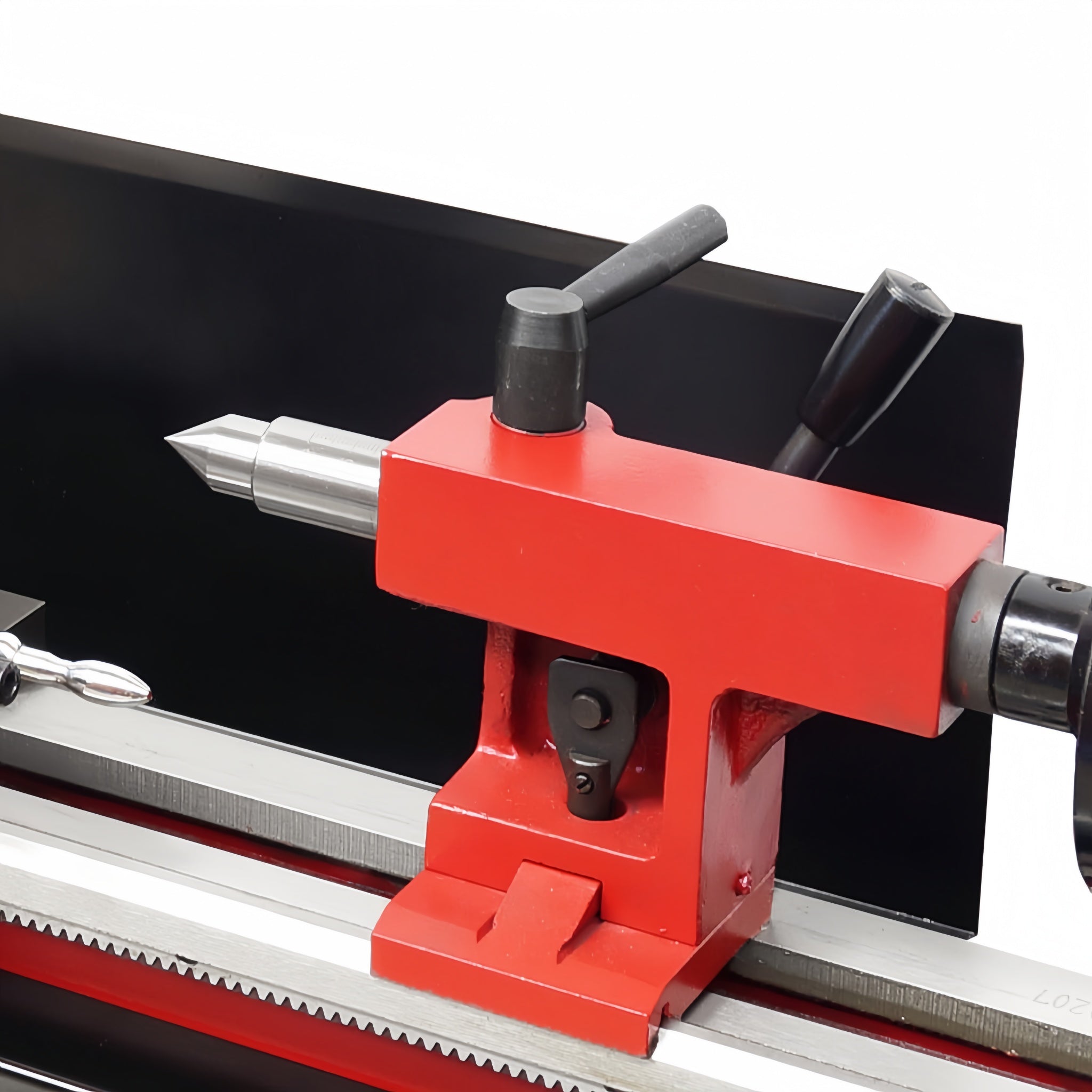 A close-up of a red metal lathe tailstock or cutting head with black handles and silver metal components, mounted on a machine bed. The brand name 'Ausee Machines & Tools' is watermarked at the bottom.