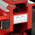 Close-up of a red industrial bench vise with a white label reading 'INDUCTION HARDENED BEDWAYS' and simple line icons above it.