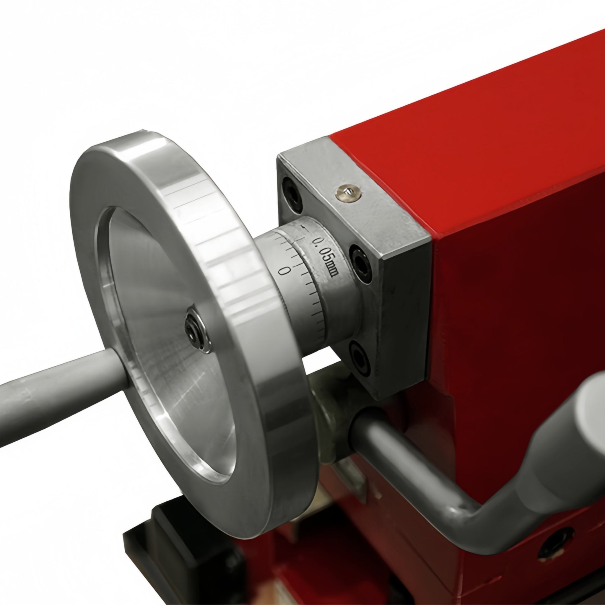 Close-up of a red and silver metal machine component with a large circular dial and adjustment screw, shown on a white background.