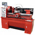 Red metal lathe machine with digital display on a white background