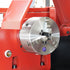Close-up of a red machine tool with a metallic component