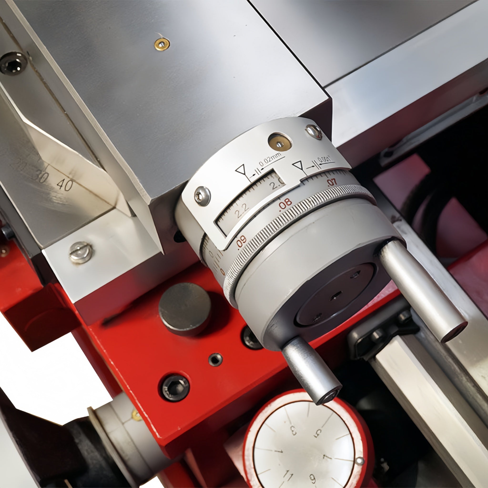 Close-up of a mechanical device with a dial and metal components.