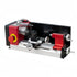 A metal lathe machine with a red and black body, silver metal bed and components, and a yellow adjustment dial, shown on a plain white background.