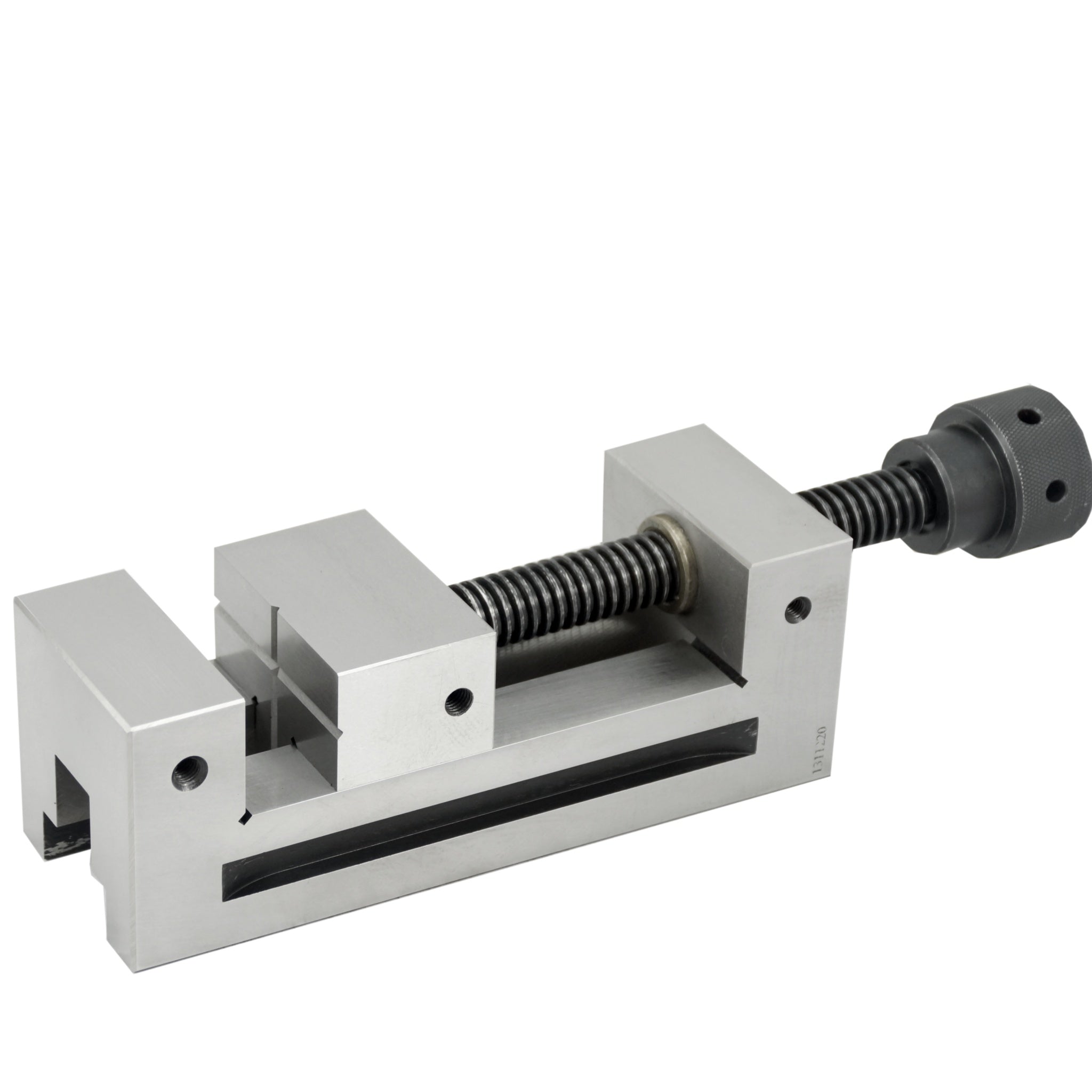 A silver-colored precision tool vice with a rotating handle and metal construction, used for clamping materials in a workshop setting.