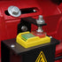 Close-up of a red mechanical component with bolts and a yellow safety switch.