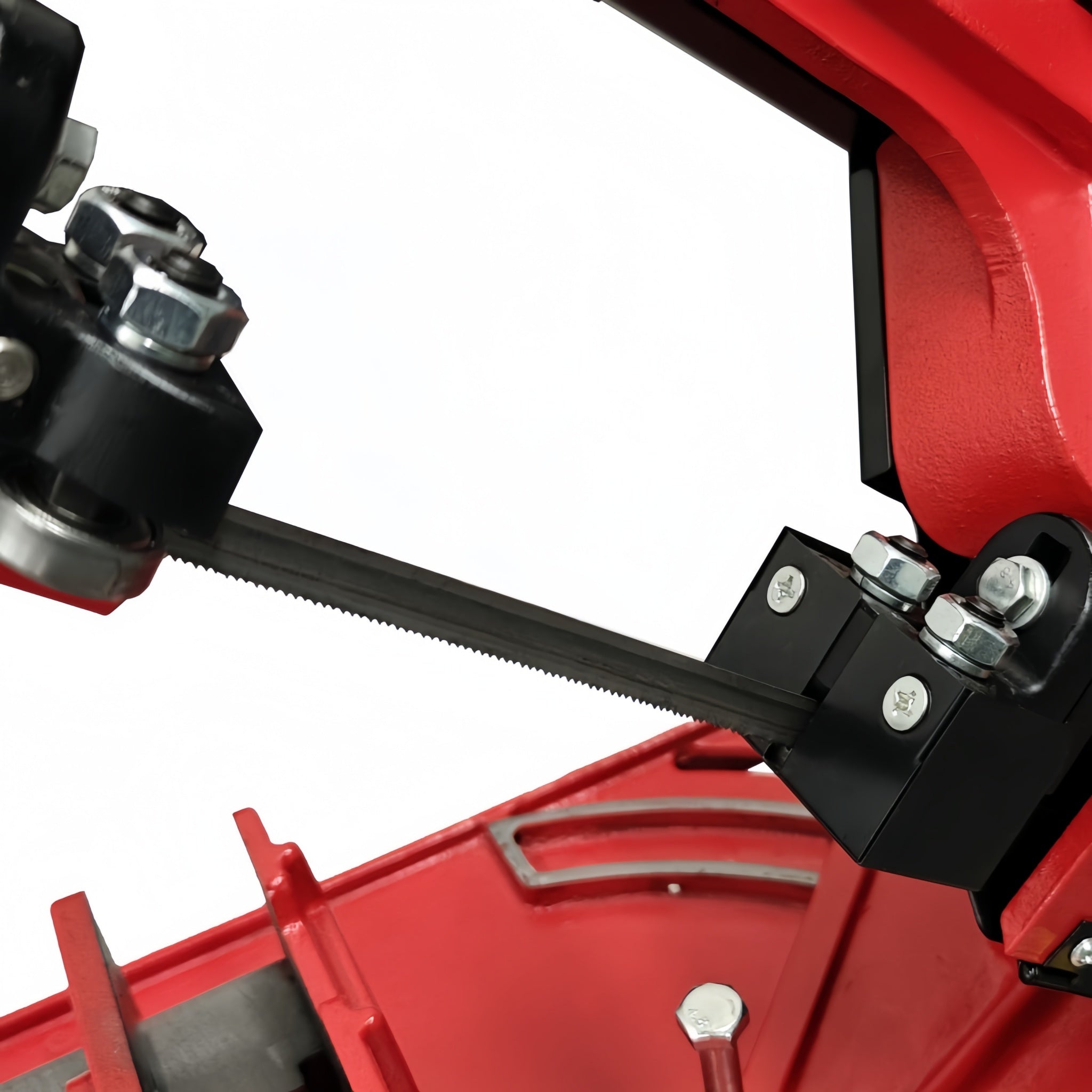 Close-up of a red mechanical component with black and silver parts on a white background