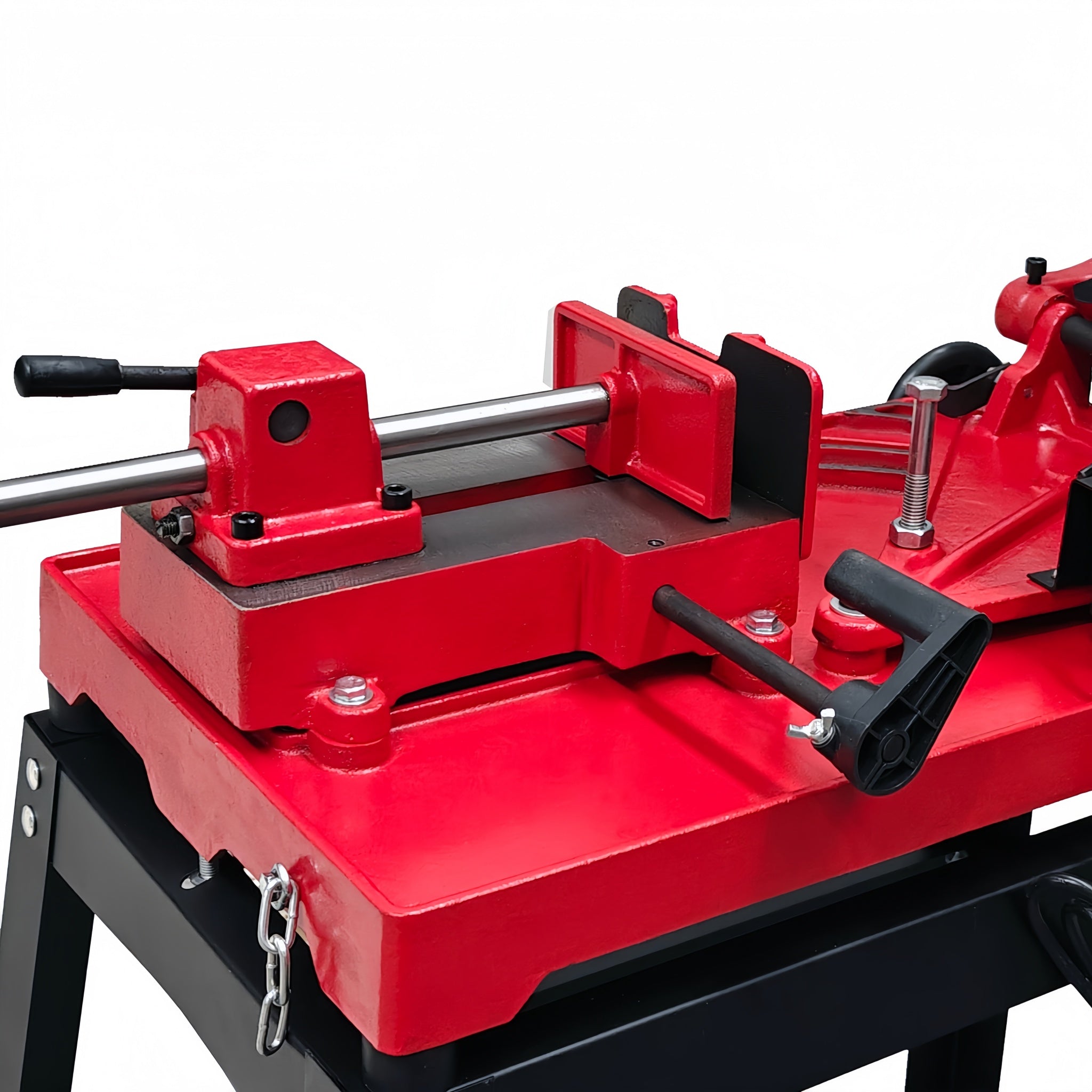 Red metal workbench vise on a white background