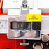 Close-up of a digital caliper display showing 0.000 inches, with a yellow warning label that says 'No display please check the battery!'.