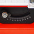 Close-up of a black dials and gauges on a red machine, showing a temperature or angle scale from 0 to 45 degrees.