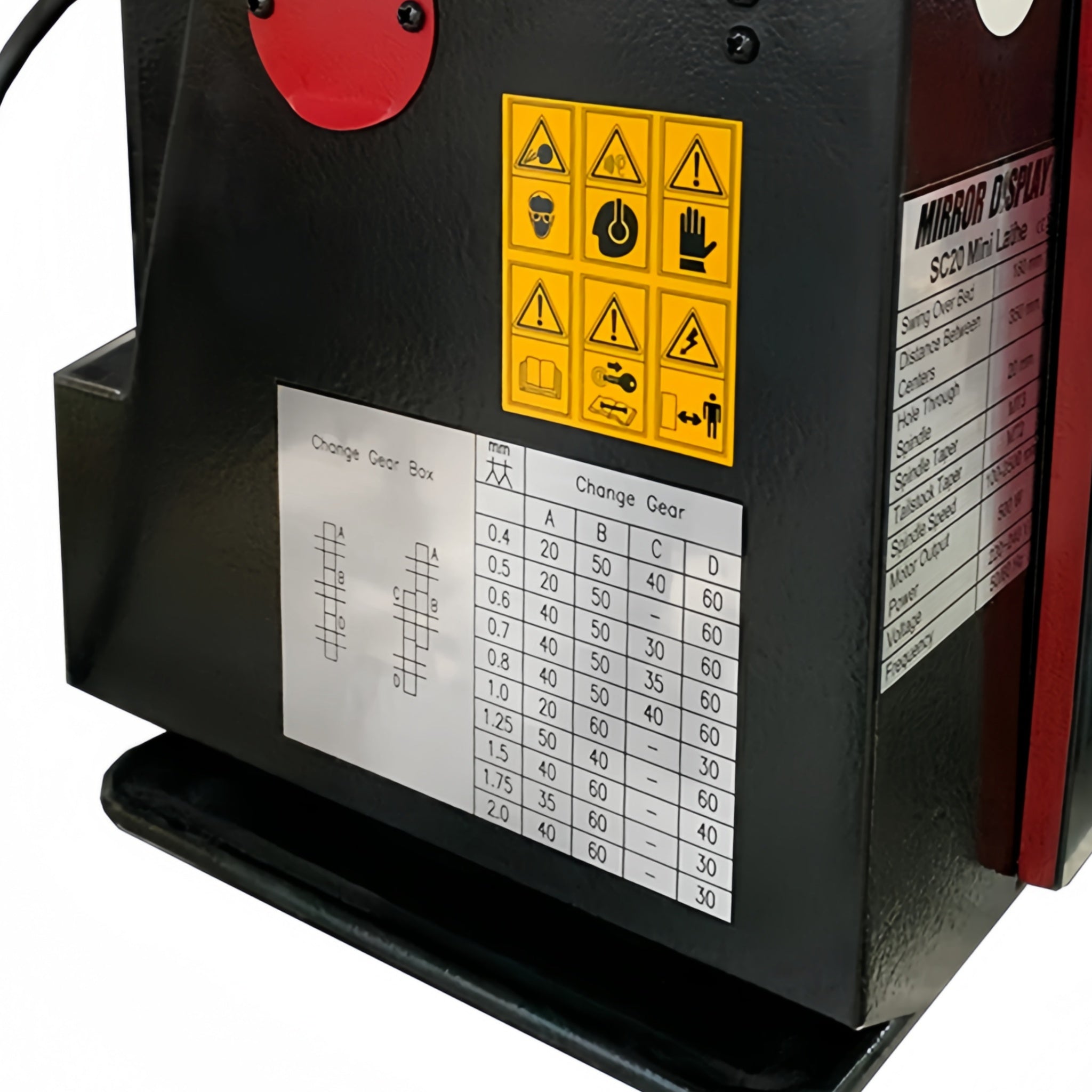 A black and red industrial machine with a digital display, control knobs, safety labels, and a measurement chart on the front panel, photographed on a white background.